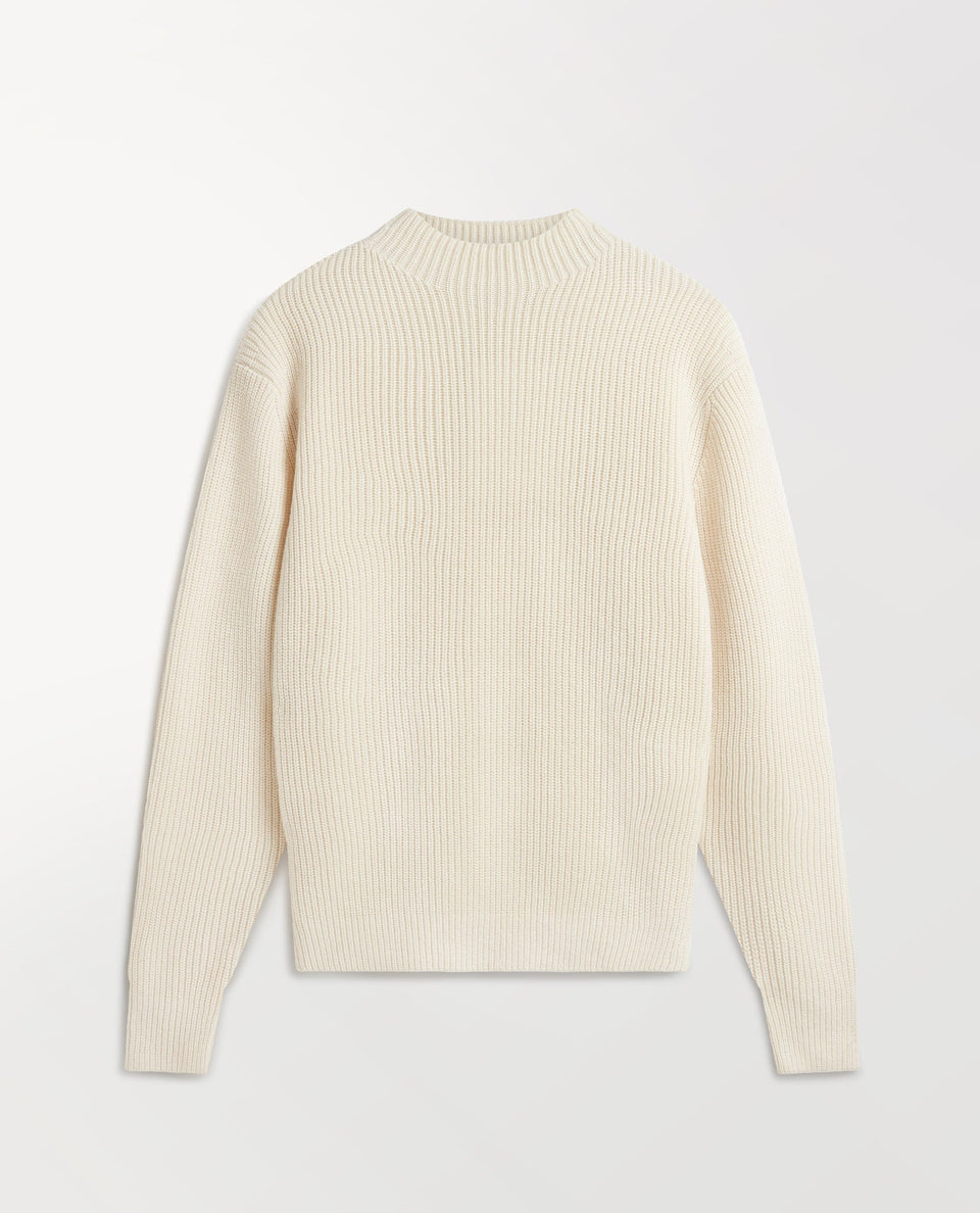 Close up of Rise & Fall's cream cashmere merino stand neck jumper.