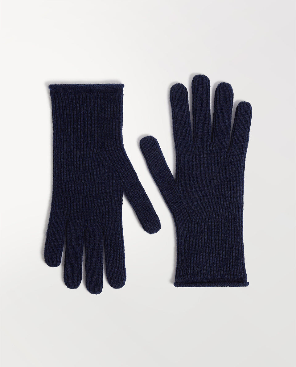 Close up of Rise & Fall's indigio cashmere merino ribbed gloves