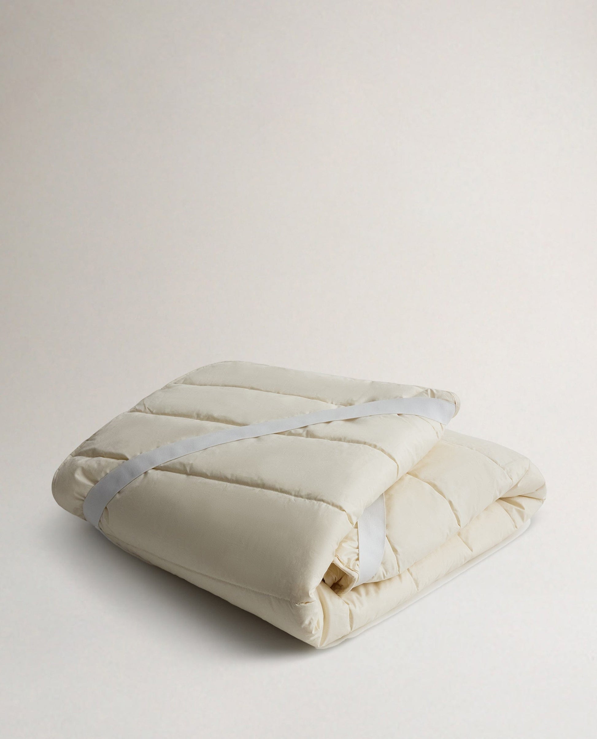Rise & Fall's Luxury British Wool Matress Protector folded up.