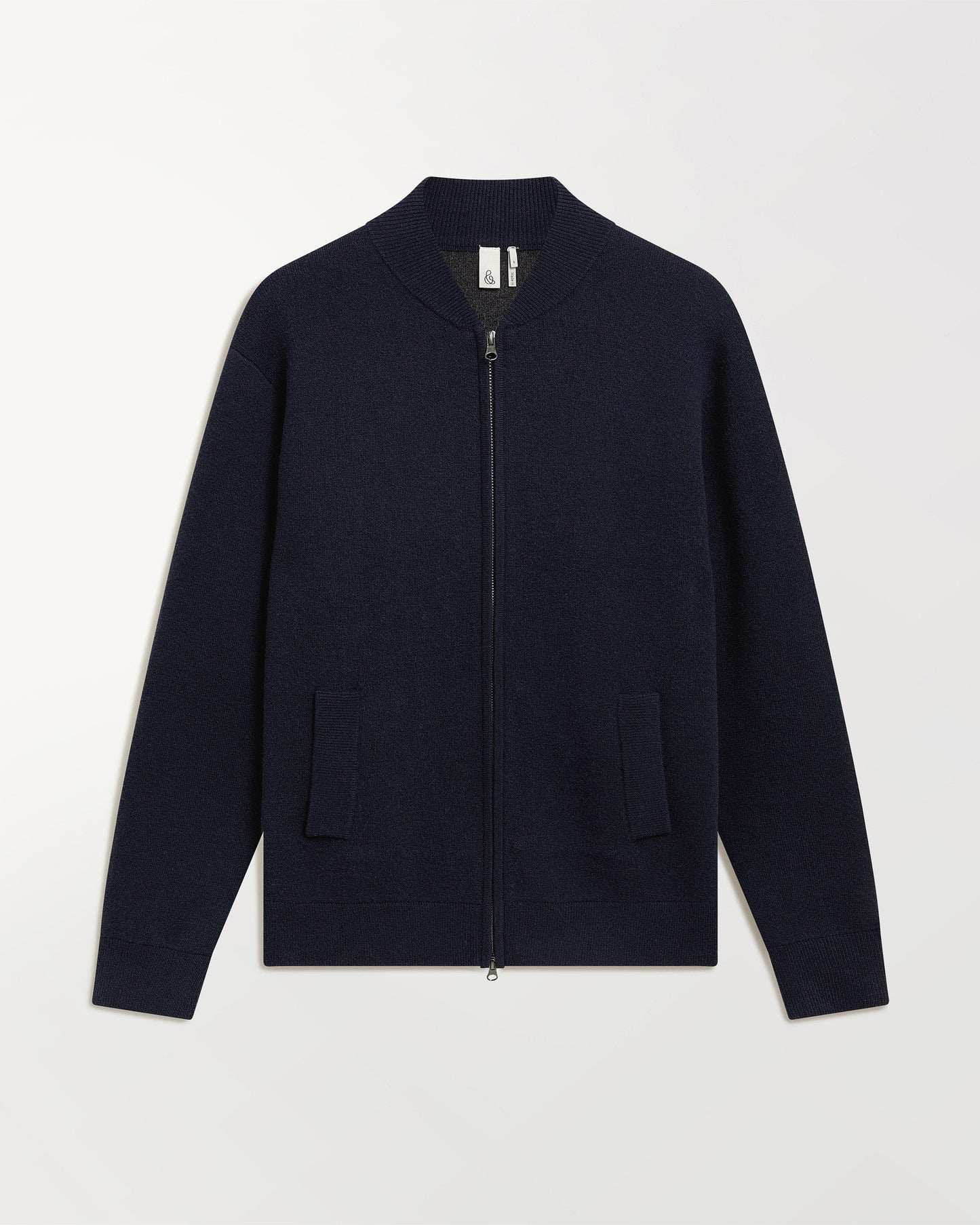 Close up of Rise & Fall's navy cashmere merino double faced bomber jacket.