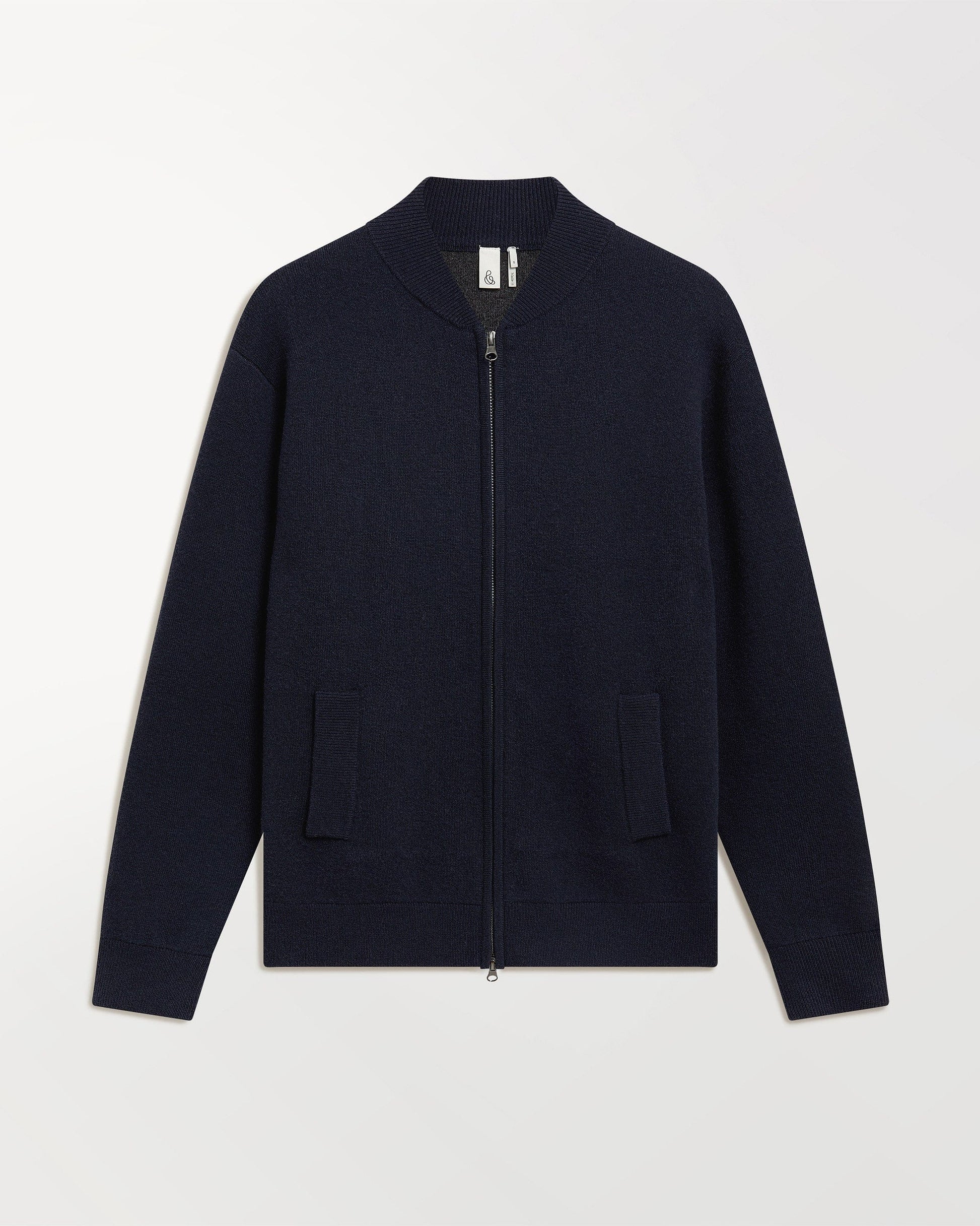 Close up of Rise & Fall's navy cashmere merino double faced bomber jacket.