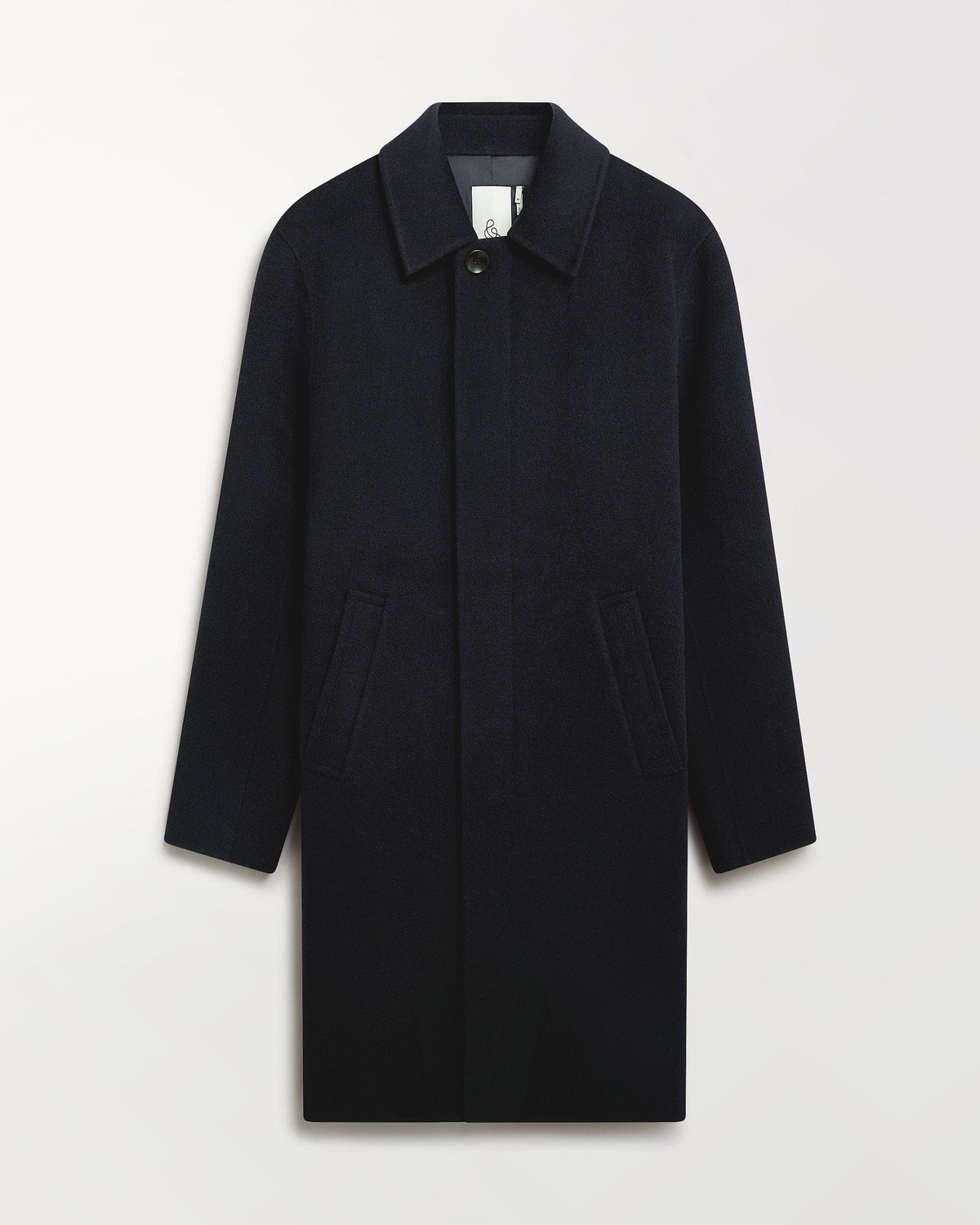 Close up of Rise & Fall's navy cashmere merino double-faced wool coat.