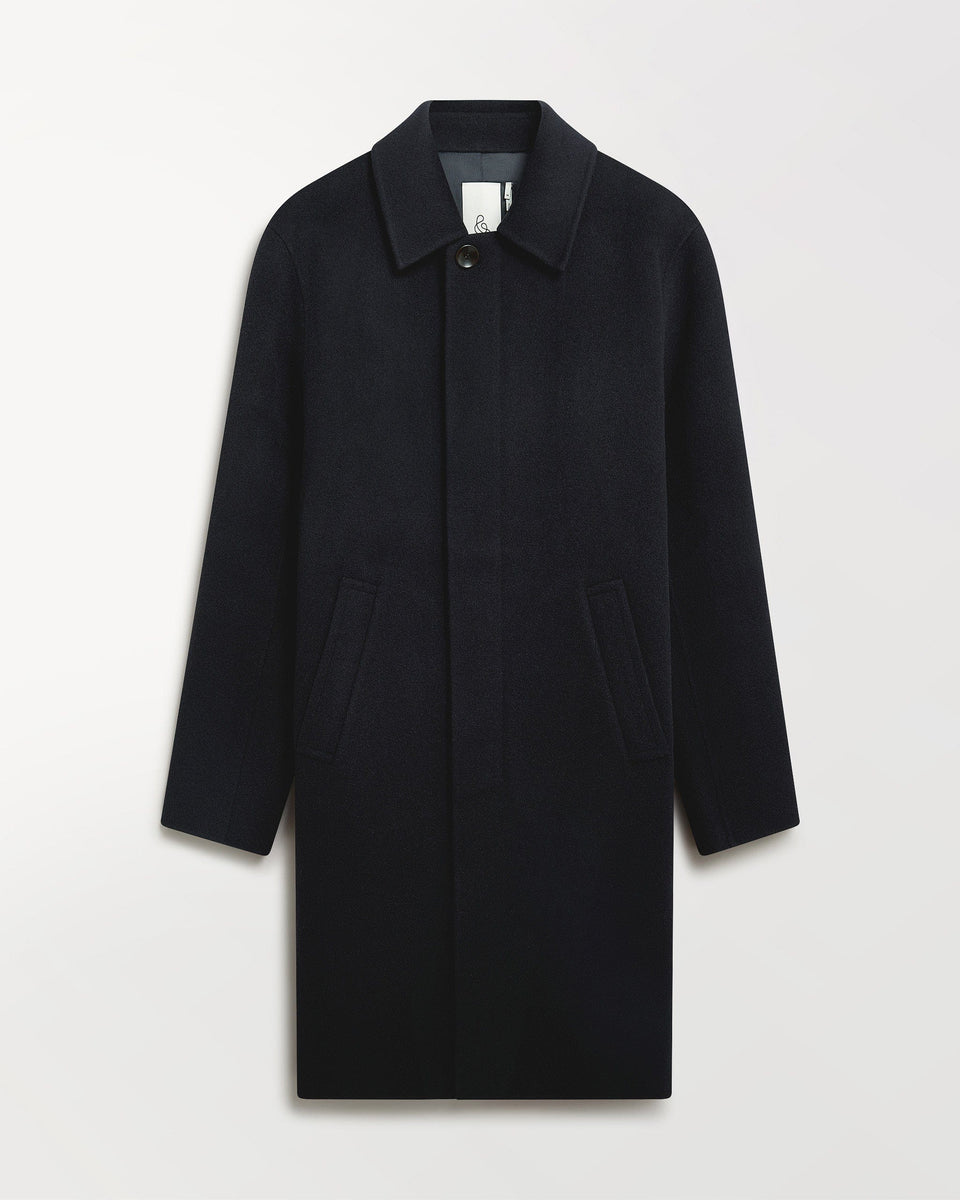 Close up of Rise & Fall's navy cashmere merino double-faced wool coat.