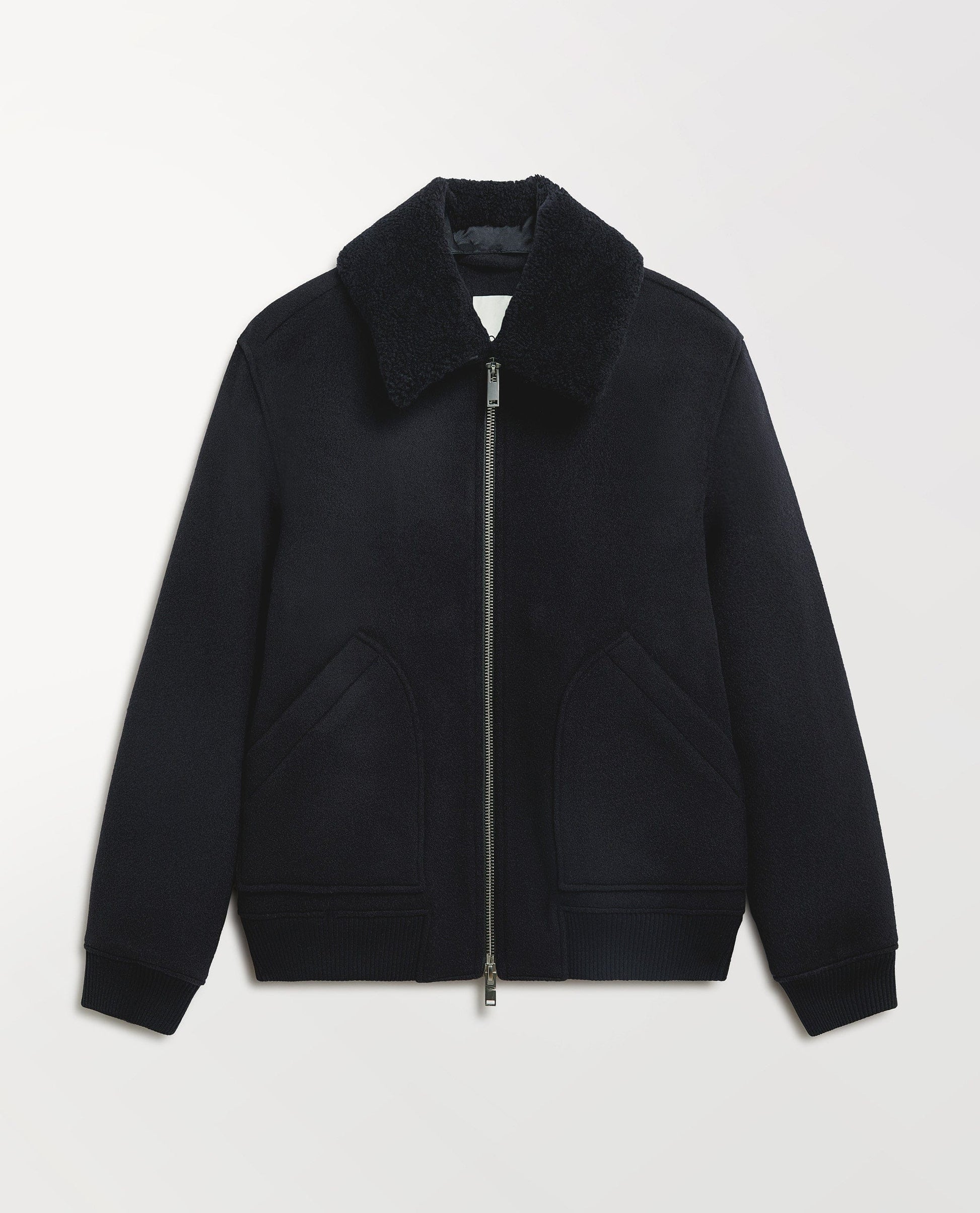 Close up Rise & Fall's navy wool bomber jacket with shearling collar.