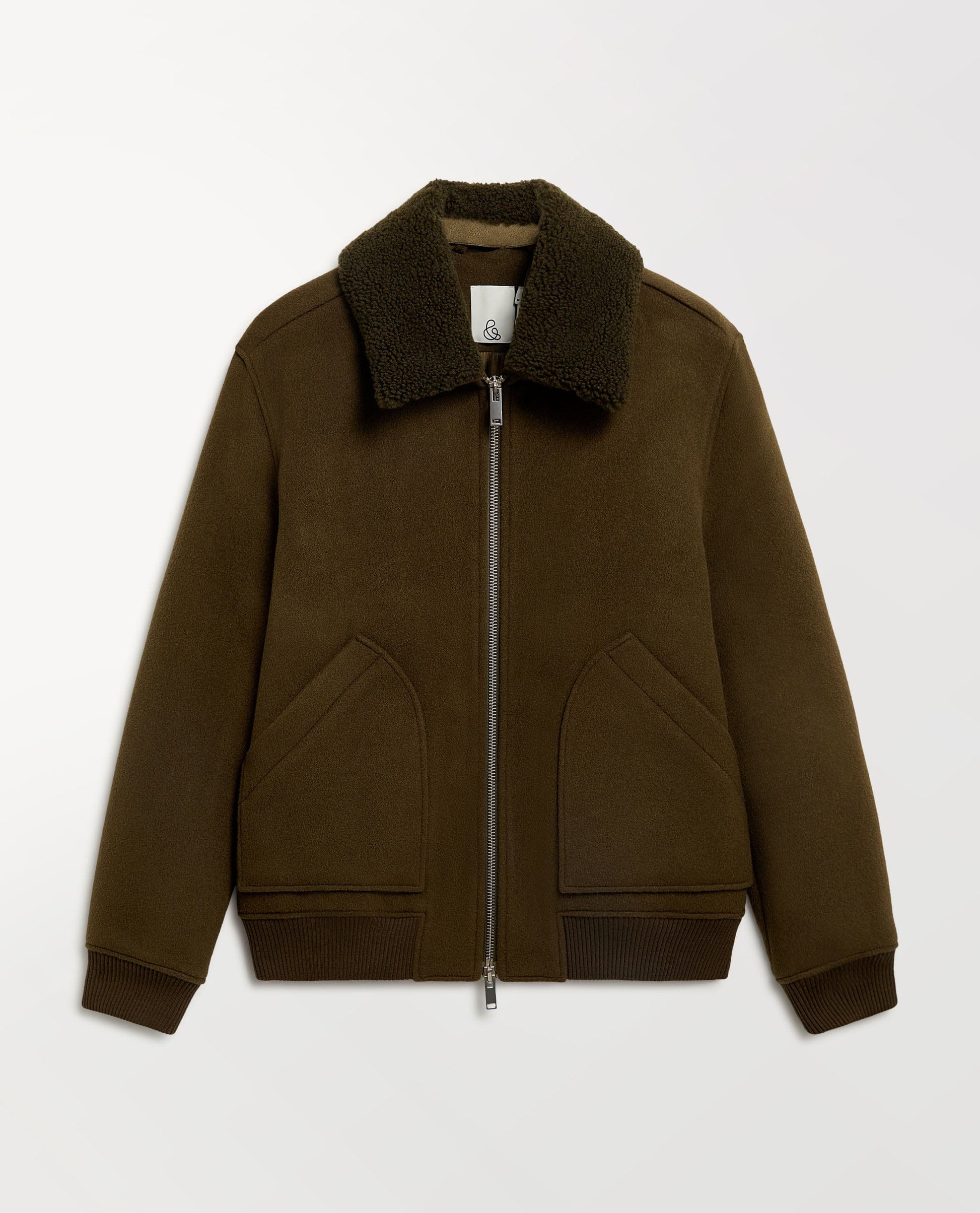 Close up Rise & Fall's olive wool bomber jacket with shearling collar.