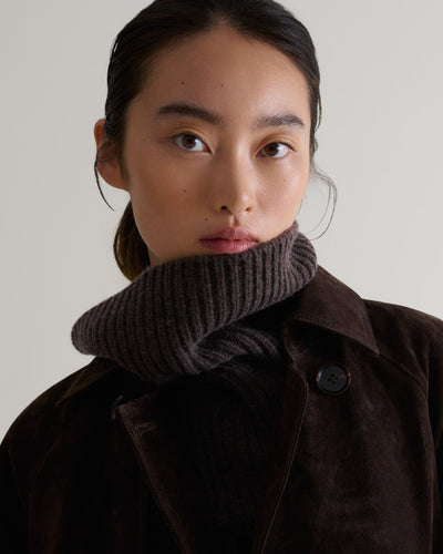 Close up of woman wearing chocolate cashmere merino ribbed collar with chocolate suede coat
