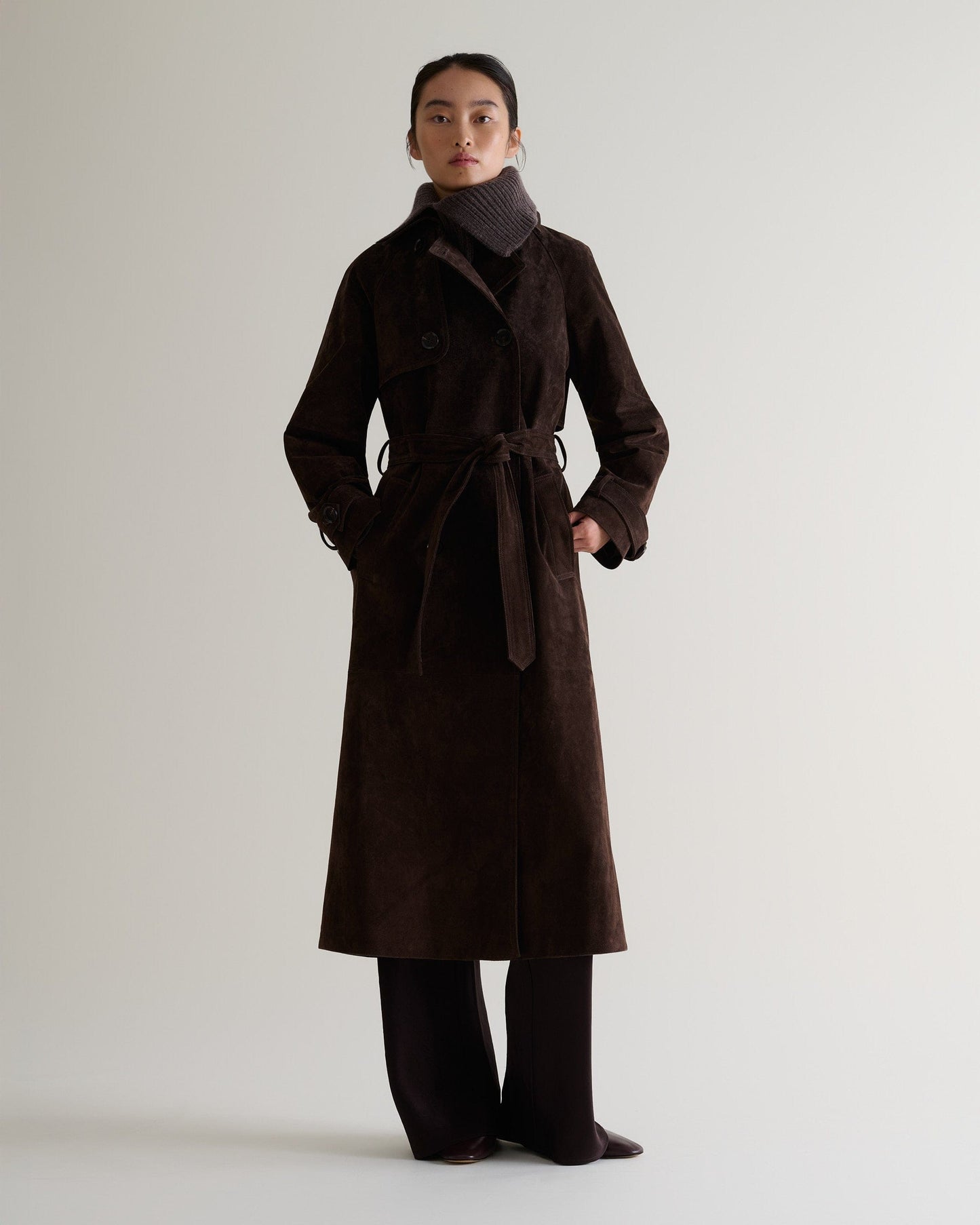 Full portrait view of woman wearing chocolate cashmere merino ribbed collar with chocolate suede coat