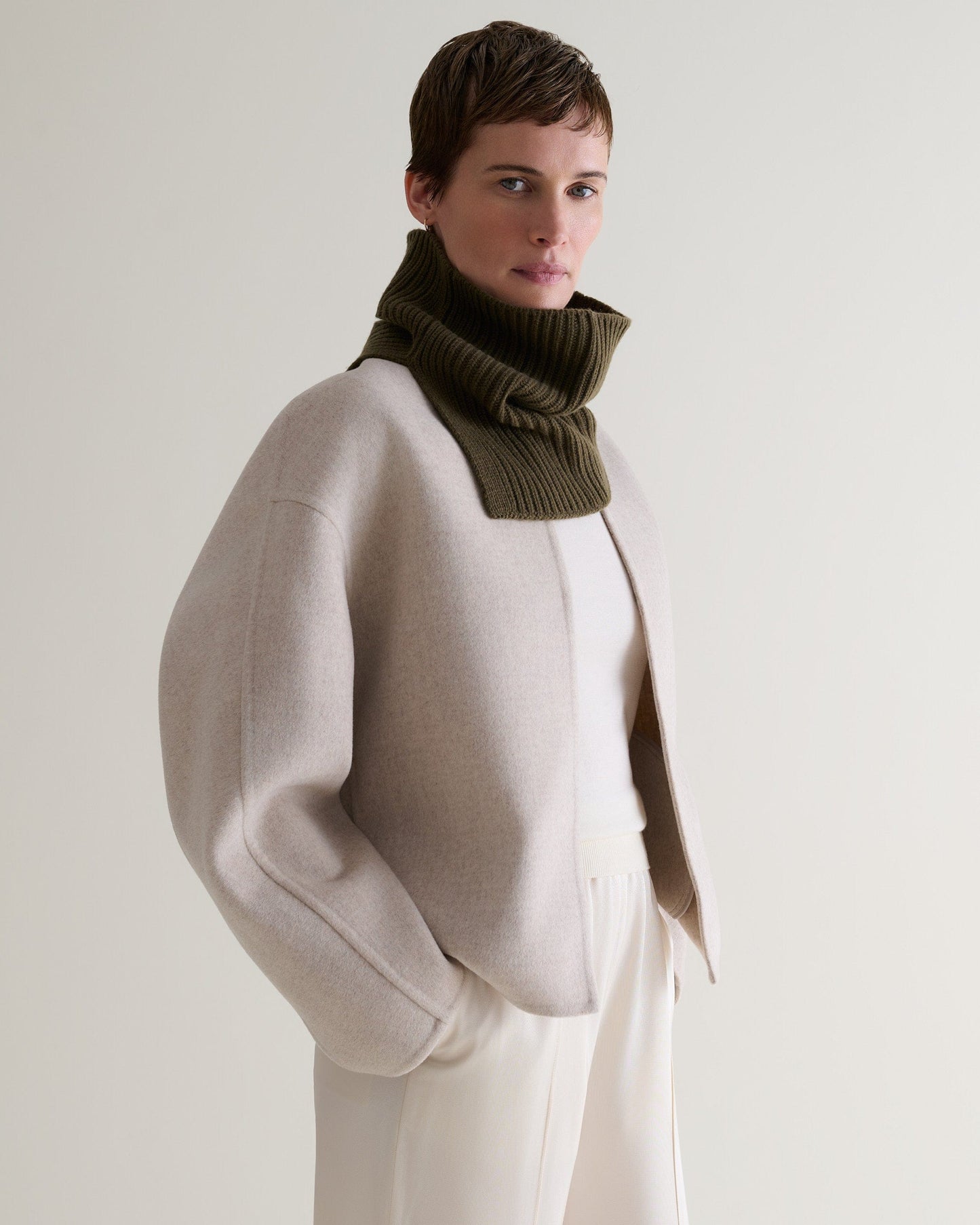 side profile of woman wearing a cashmere merino ribbed collar in military green