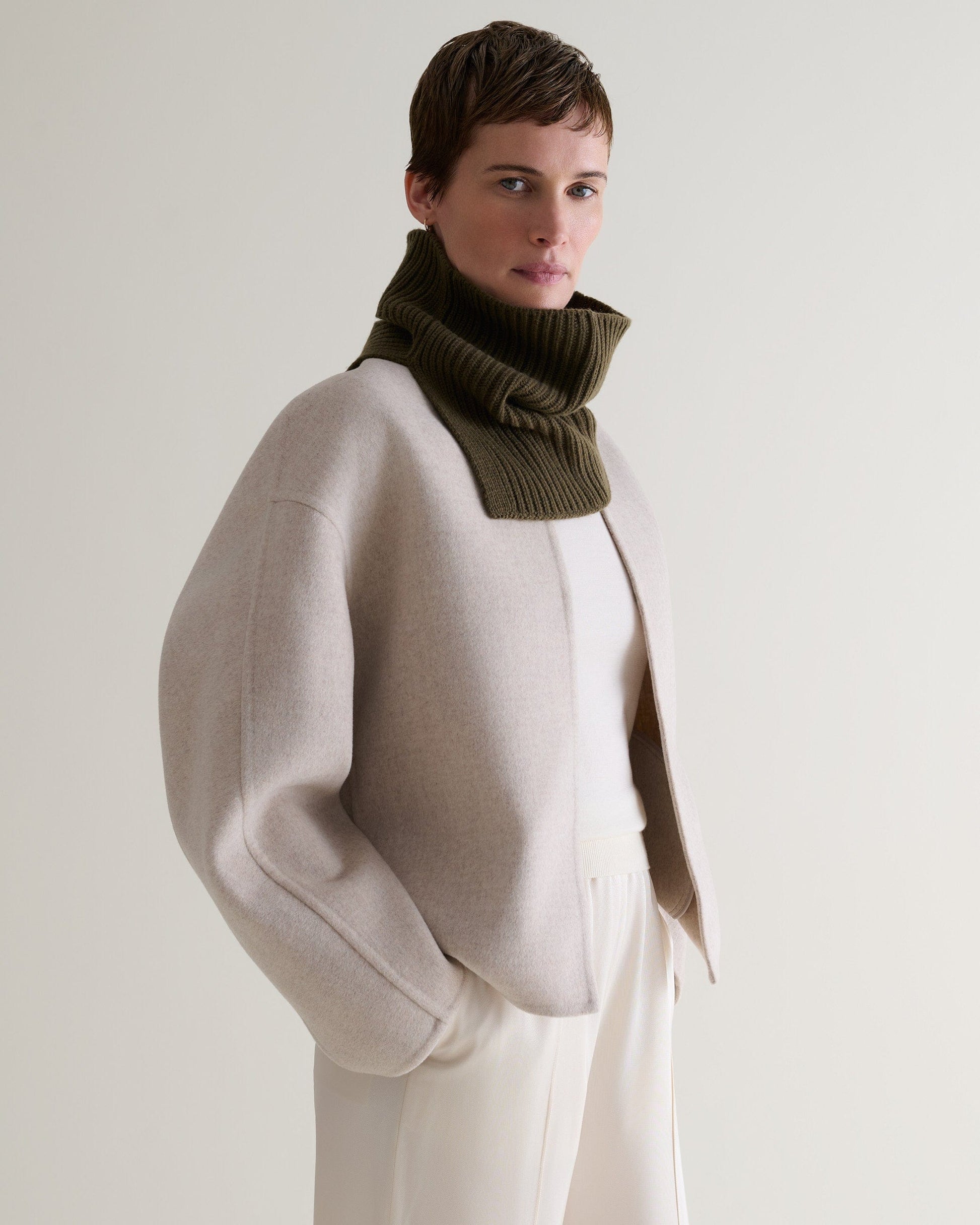 side profile of woman wearing a cashmere merino ribbed collar in military green